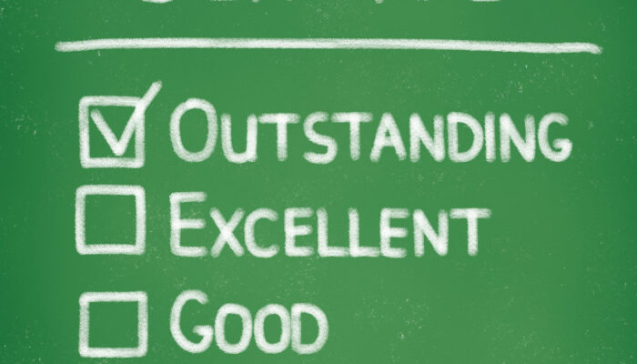 Chalk drawing, check mark on outstanding.